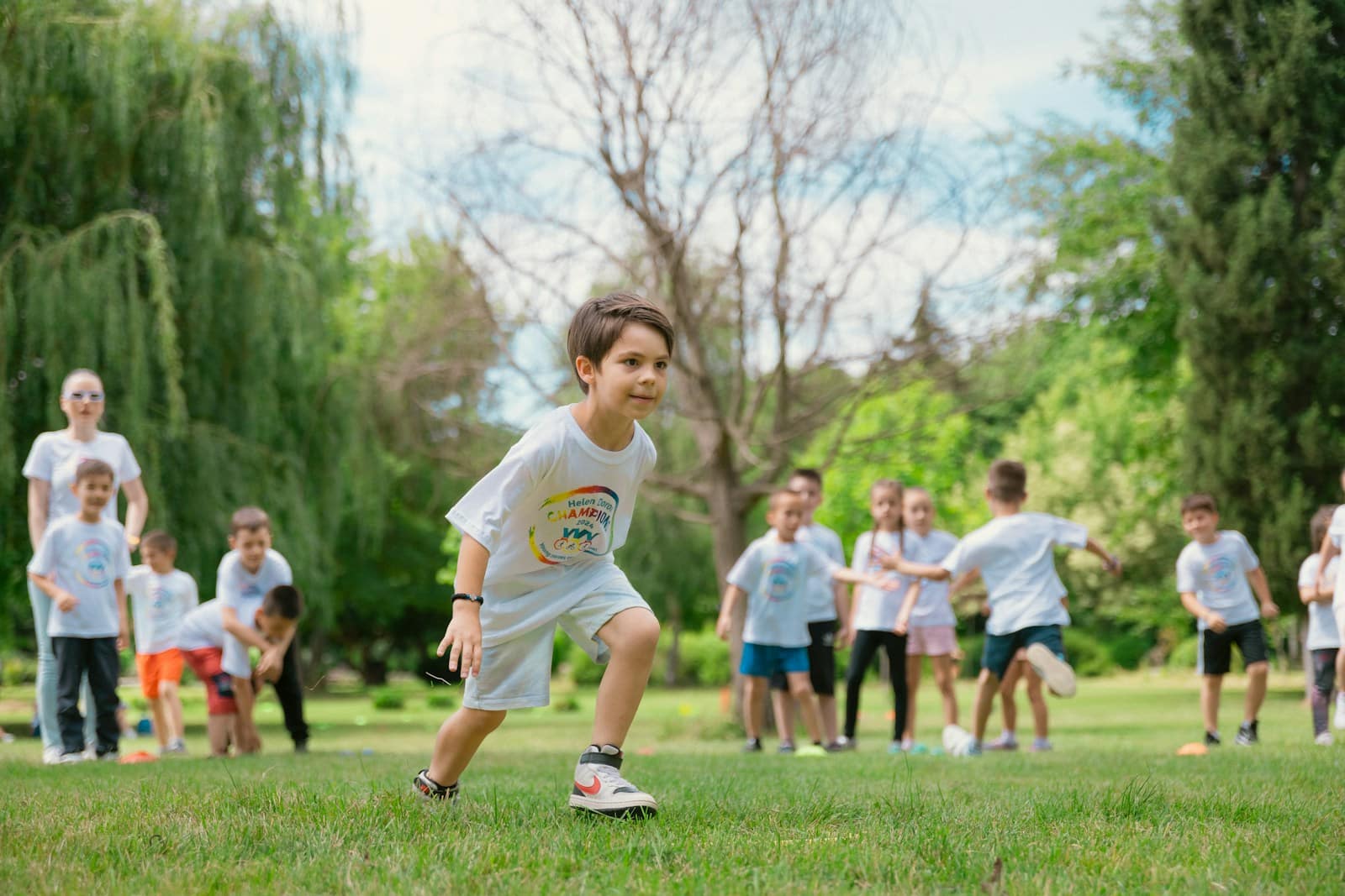 a group of young children playing a game of frisbee
